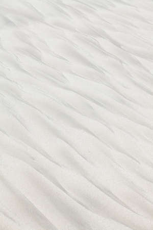 Strange wave-like patterns on the beach sandの写真素材