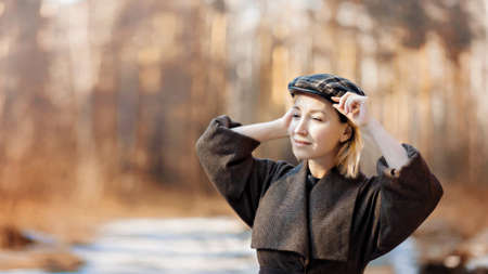 Spring Style. Beautiful Young Woman In Nice Spring clothes in Beautiful Spring forestの写真素材