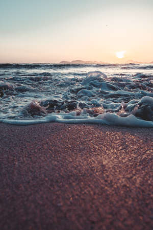 Waves crashing to the sandの写真素材