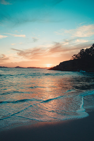 Blue tones over the beach during a sunsetの写真素材