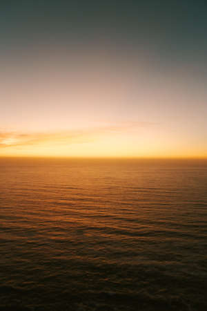 Minimalistic yellow gradient in the horizonの写真素材