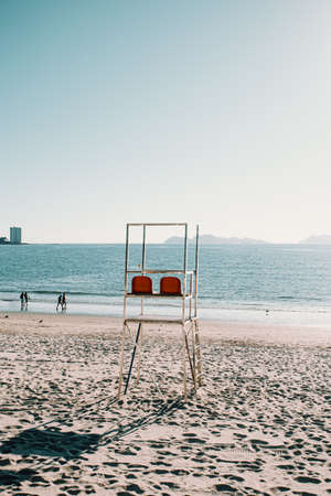 Baywatch chairs on the beach during summerの写真素材
