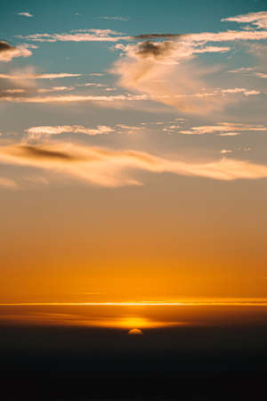 The exactly moment just before the sun disappears during the sunsetの写真素材