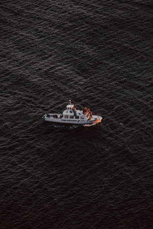 A tourist boat in the middle of the oceanの写真素材
