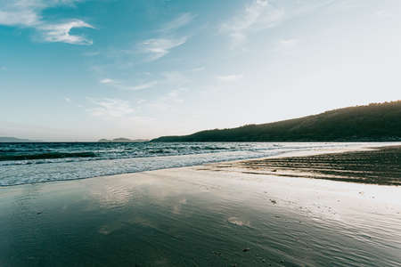 An horizontal shot of a massive beach during the summerの写真素材