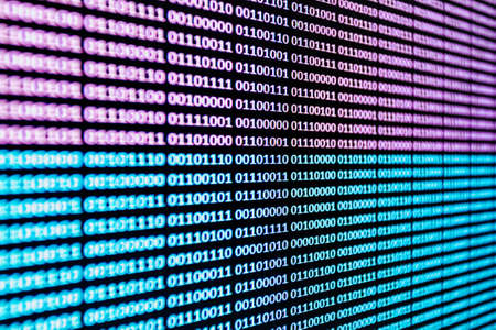 Horizontal background of binary language over a screen in pink and blueの写真素材