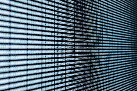 A white binary language over a screen backgroundの写真素材