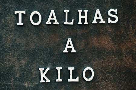 A poster in Portuguese selling towels per kilogramsの写真素材