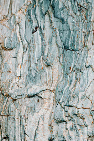 A vertical blue stone sheet flat background with brown linesの写真素材