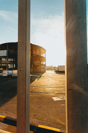 The industrial port of vigo during a orange sunset from the fenceの写真素材