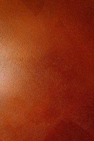 A super textured red background with a light pointed at it