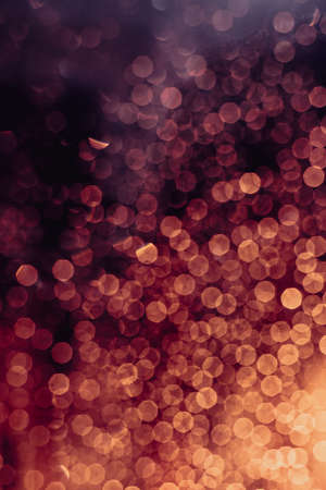 A background of some reds and magenta out of focus light spotsの写真素材