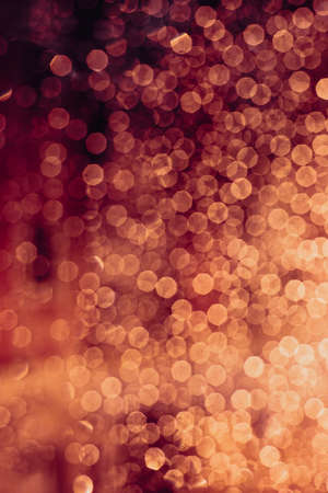 A background of some reds and magenta out of focus light spotsの写真素材