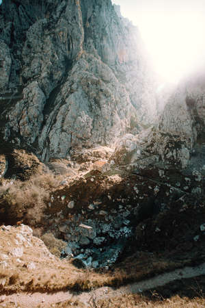 A light bean entering between the giant rocky mountains in spainの写真素材