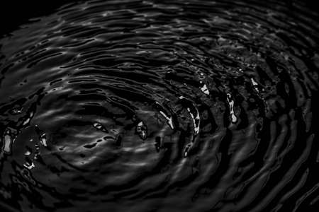Some relaxing time stopped water background in black tones vibratingの写真素材