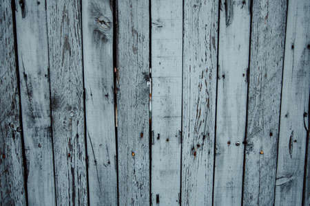 A flat background of a some white wooden tables with copy spaceの写真素材