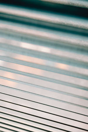 A close up wallpaper of a blind with cinematic tones during a sunny dayの写真素材