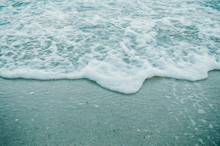 A black and white super texture and repetitive background of the sand of the beach with a great patternの写真素材