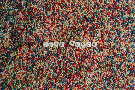 Super colorful mock up signal with happy and fun concept, colorful balls with lets dance written in dices, background, stunning, wonderfulの写真素材