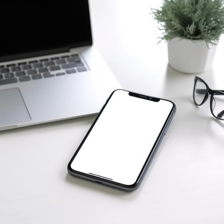 mockup with copy space of a desk with a laptop and smartphoneの素材