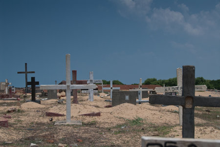 deserted derelict cemetary next to the ocean