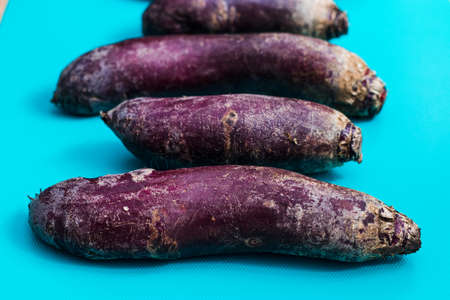 a lot of long beets on a blue background, top viewの写真素材