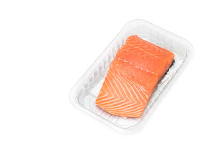salmon on wooden board isolated, takeaway cooking process,の写真素材