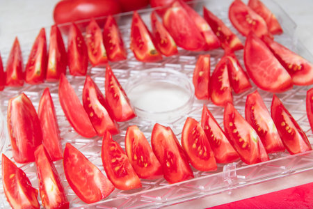 drying tomatoes in a dryer, cooking process, storage of crops,