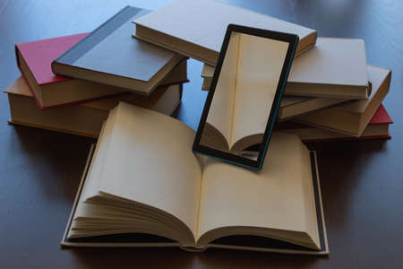 plenty of important reading books and e-book reader where you can include your reading for convenienceの写真素材