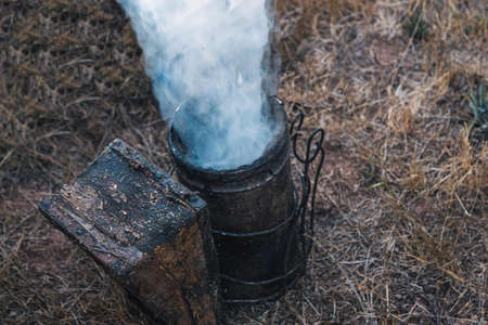 preparing the smoking container to stun the bees without a lid and to smoke in the fieldの写真素材