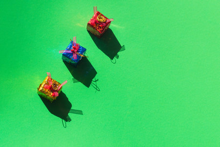 three christmas gifts on green background concept kings and gold incense and myrrh with copy space