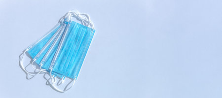 Medical mask, medical protective masks on blue-white background with copy space The disposable...