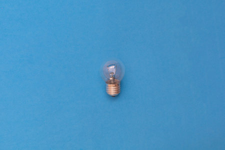 tungsten bulb on blue background concept idea thinking startup business