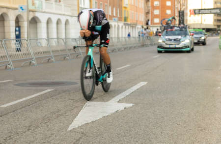 BURGOS, SPAIN - August 14, 2021: Riders of the Tour of Spain cycling race in an individual time trial for the eighth centenary of the Cathedral of Burgos first stage with selective focus.のeditorial素材