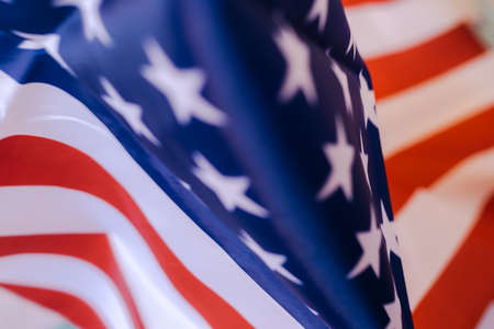 United States flag folded by the stars and stripes with selective focus as background and copy space.の写真素材