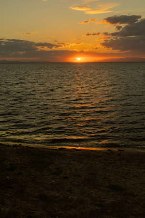 sunset on the beach of la manga del mar menor in spainの写真素材