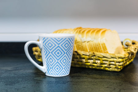 wicker tray with slices of toast and a cup of coffee