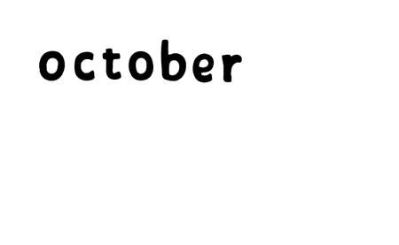 word with the name of the month October in black on a white backgroundの写真素材