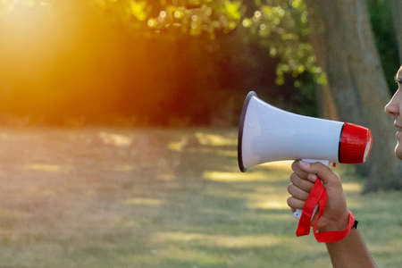person holding a magaphone with loudspeaker with copy spaceの写真素材