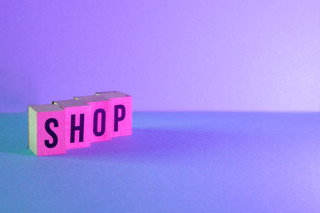 wooden letters with the word SHOP on blue backgroundの写真素材