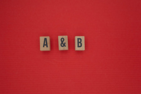 Letters A and B separated by ampersand symbol on red background