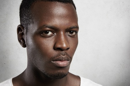 Lose Up Portrait Of Young Confident Dark Skinned Man With