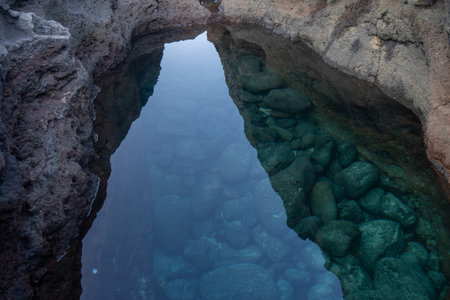Puddle with crystal clear water. This photo was taken in Charco Manso. This puddle is located on the Island of El Hierro, Canary Islandsの写真素材