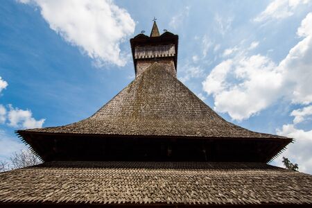 Roof with wooden shingles of a traditional romanian church in maramuresの写真素材