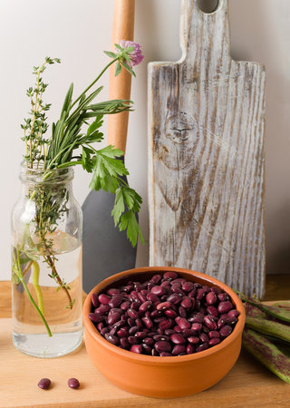 Beans in a clay bowl, concept food background with natural ingredientsの写真素材