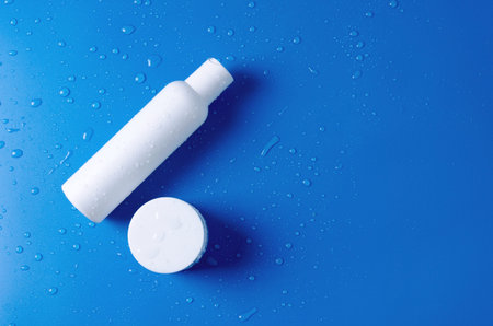 Template concept for the sale of a cosmetic product. White cosmetic bottle with lotion, water, cream...