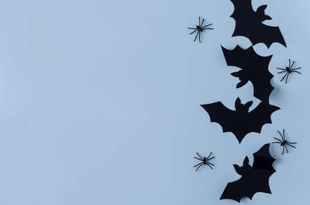 Background Halloween. Paper bats and spiders lie on a black background, copying space, flat layoutの写真素材