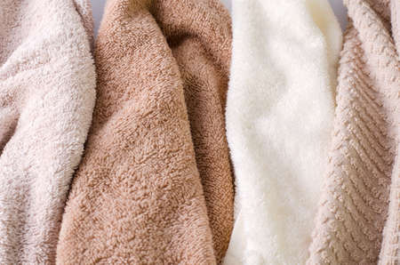 Background texture towel close-up. Background for demonstration of cosmetic product, shampoos, gels, soap, washing powder, selective focusの写真素材