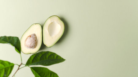 Avocado on a green background, plant background for demonstration of cosmetics, products with...