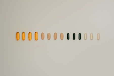 Multicolored pills on white backgroundの写真素材